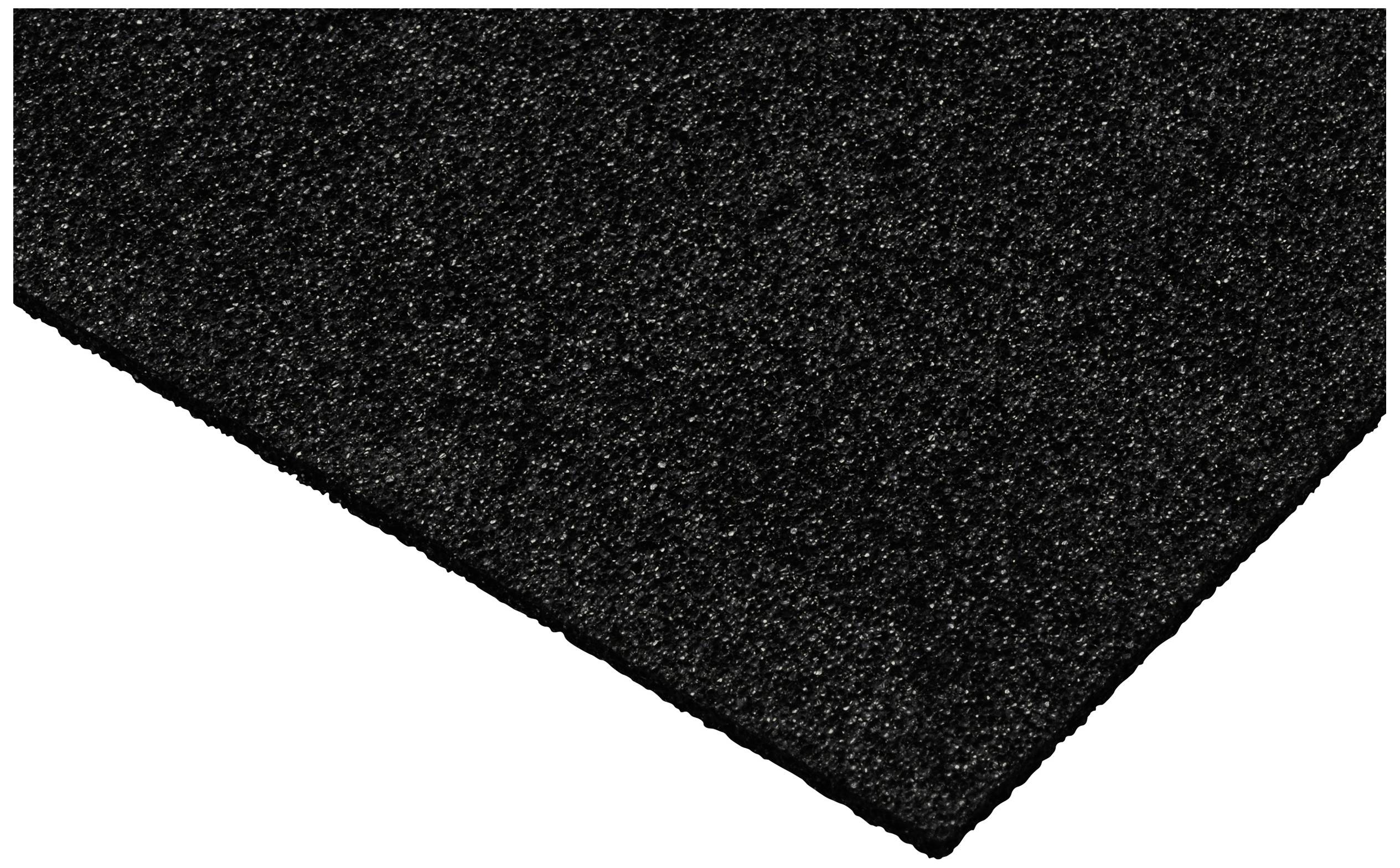 Eine schwarze, griffige Oberfläche, leicht schräg fotografiert. Das Material sieht robust und strapazierfähig aus.