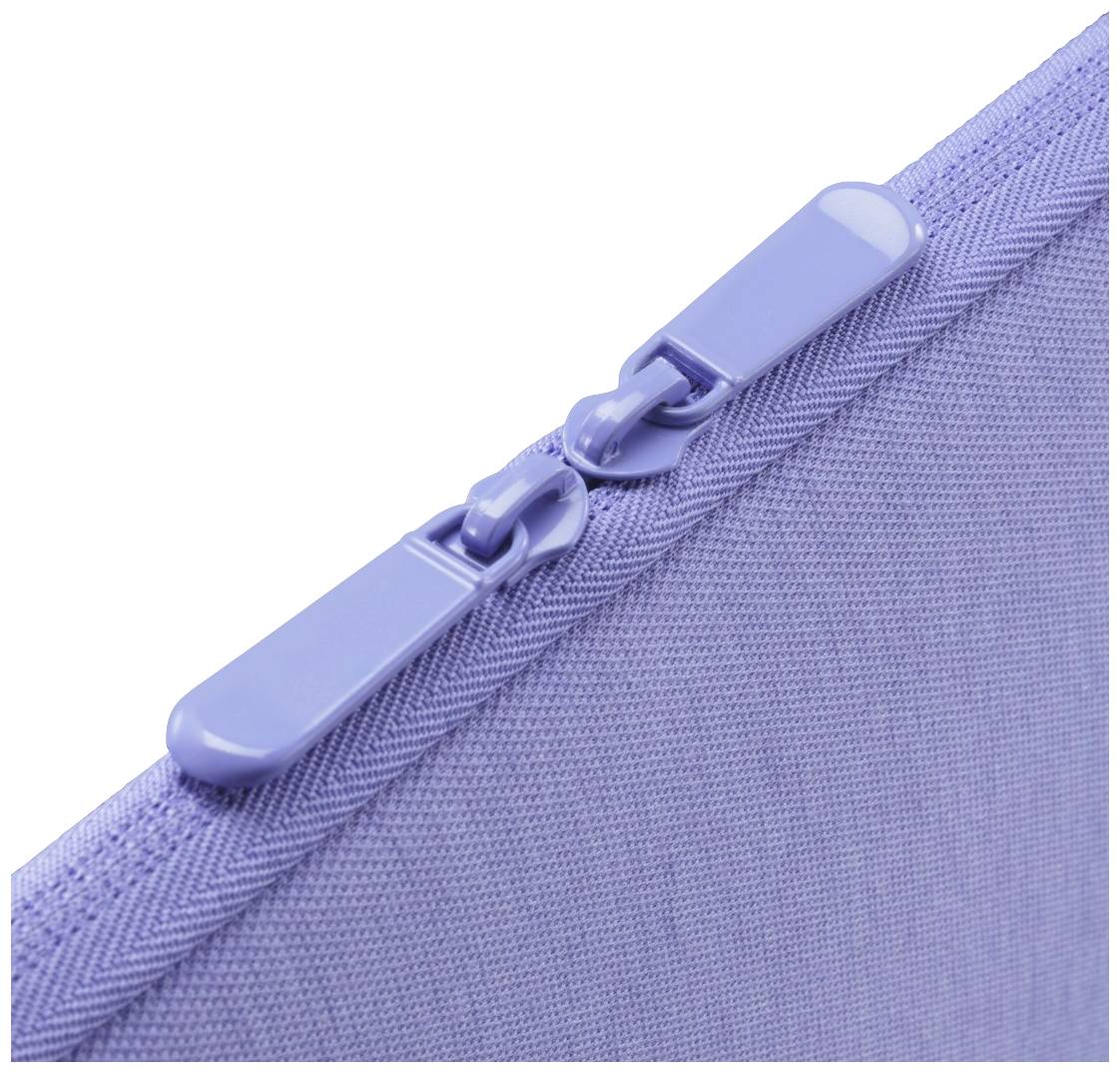 Lila Reißverschluss auf Stofftasche, Nahaufnahme.