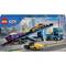 LEGO City Auto-Transporter-Set 60408: Enthält blauen Lkw mit Anhänger, zwei Autos, Figuren und Stadthintergrund. Ab 7 Jahren.