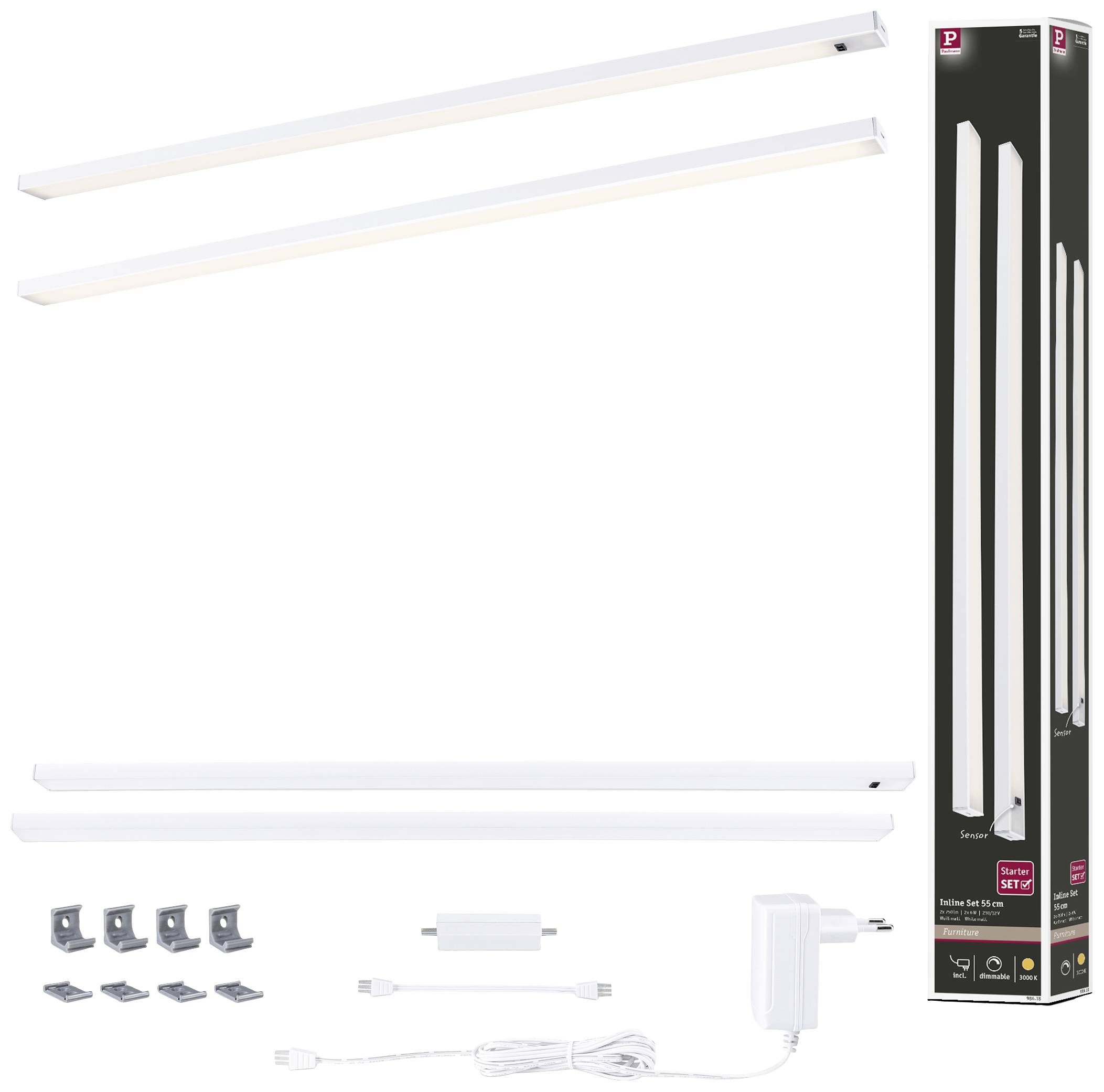 Zwei längliche LED-Leuchten, weiße Farbe, mit Zubehör: Kabel, Adapter und Montagehalterungen, neben der Verpackung dargestellt.