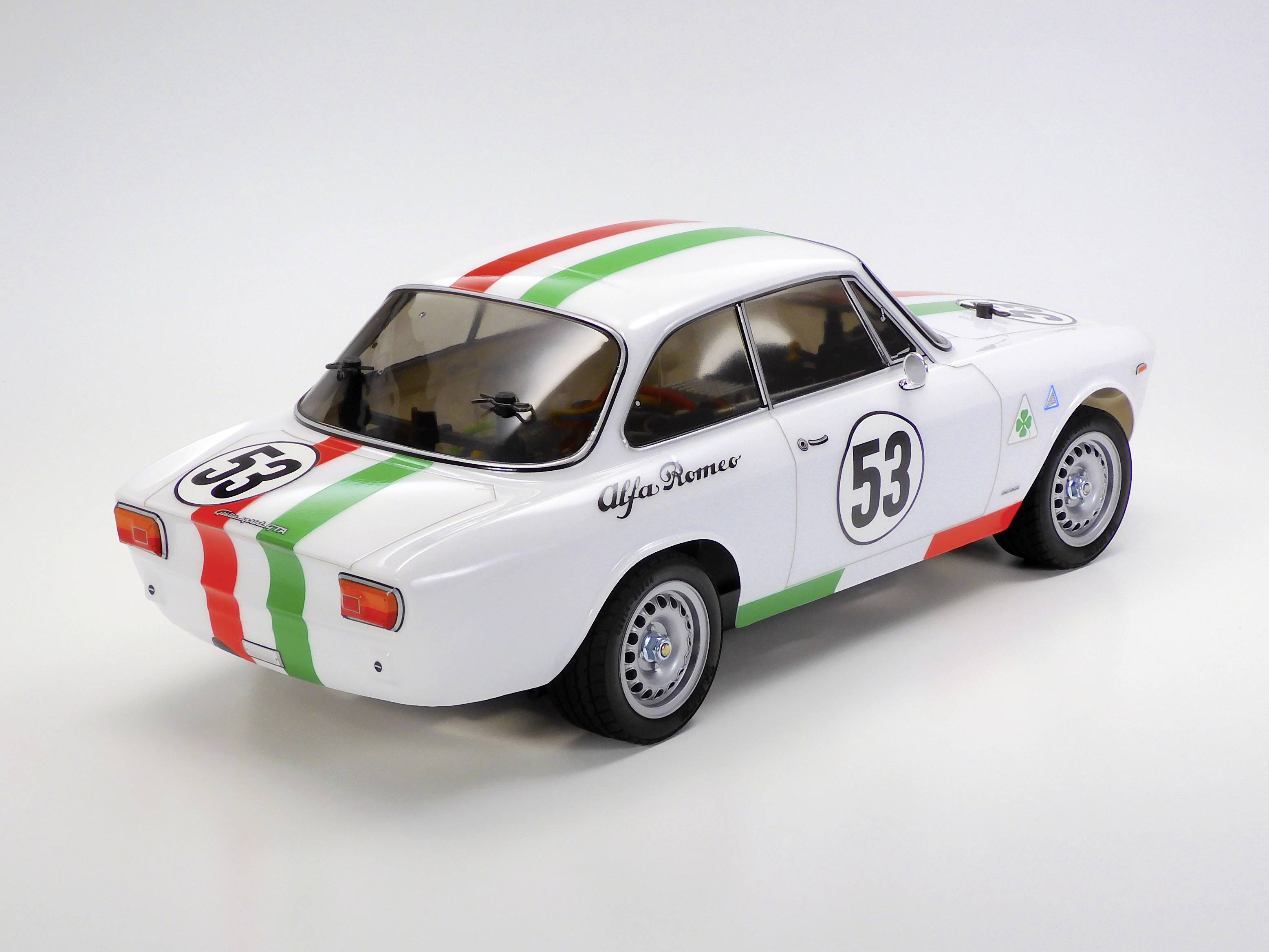 Kleines Modellauto eines Rennwagens in italienischen Farben mit der Nummer '53' an den Seiten.