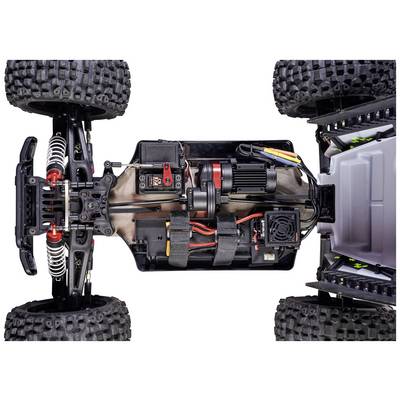 Ferngesteuertes Auto von oben, zeigt die interne Elektronik und Verkabelung, mit großen, robusten Reifen und sichtbaren Aufhängungen.
