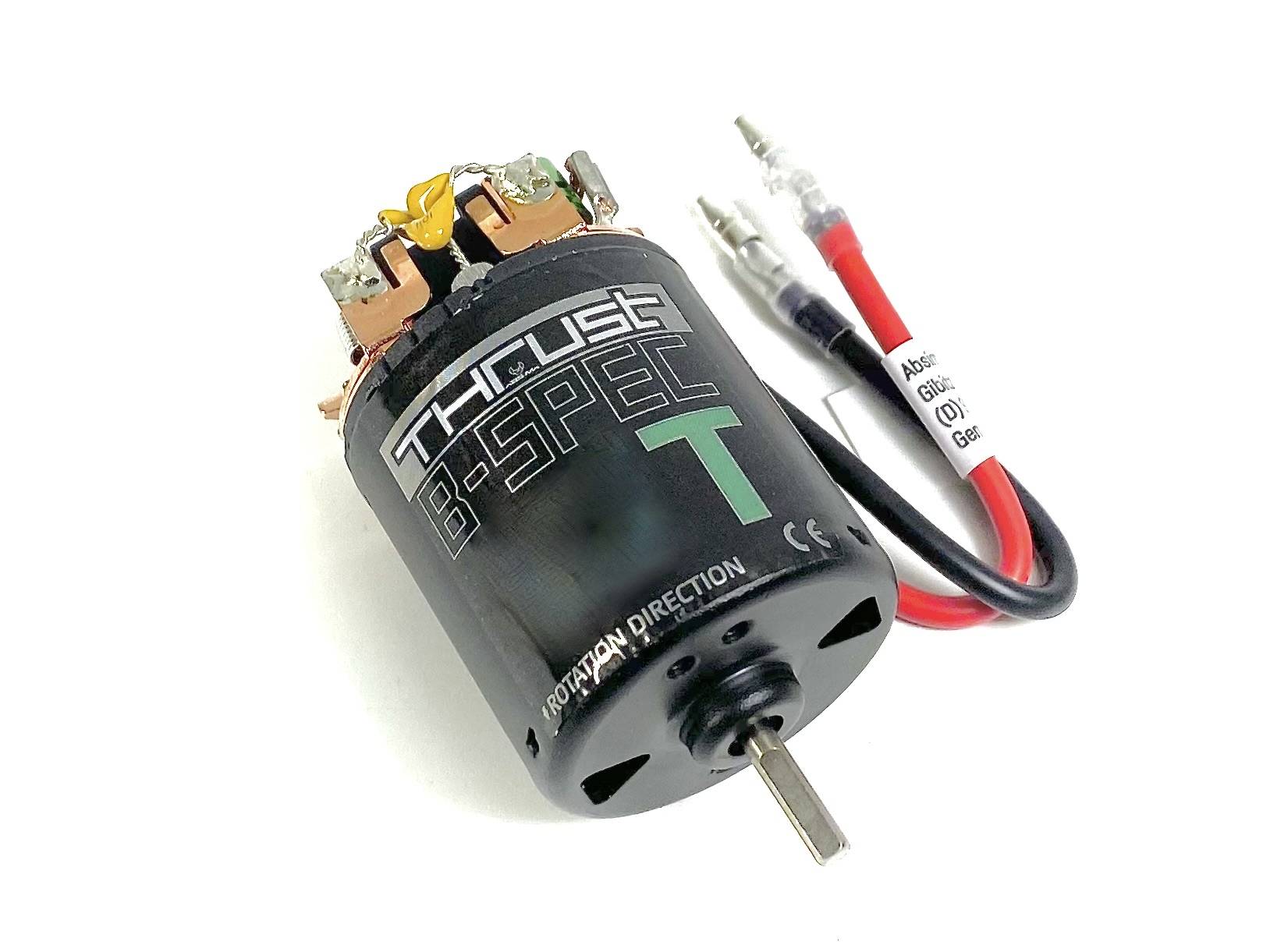 Brushless Elektromotor mit der Aufschrift 'Thrust B-Spec T'. Zwei Kabel mit Anschlüssen sind sichtbar.