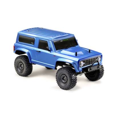 Ein blauer ferngesteuerter Geländewagen mit großen Reifen und realistischer Karosserie, geeignet für Offroad-Abenteuer.