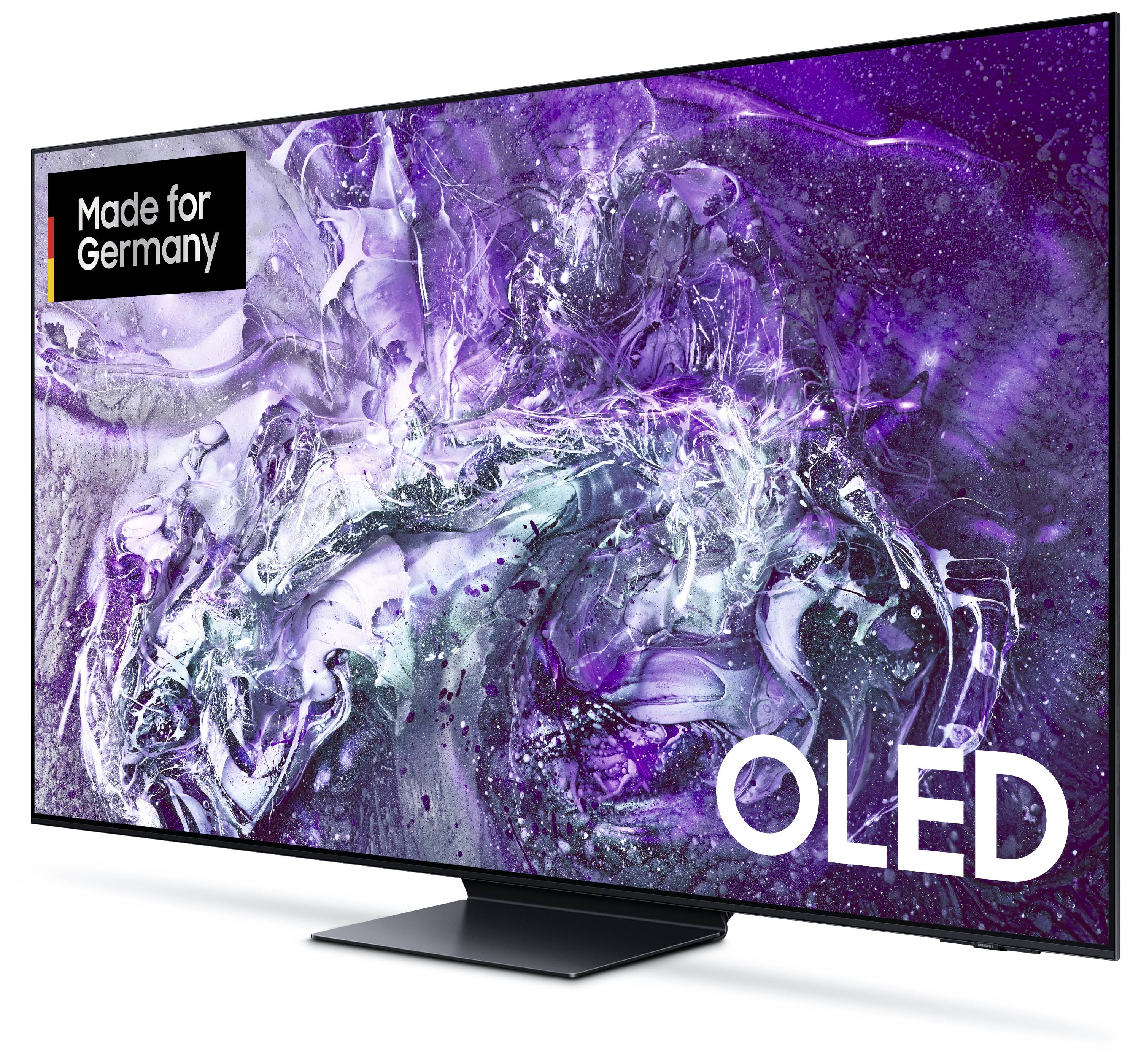 Ein OLED-Fernseher mit abstraktem lila und weißem Muster auf dem Bildschirm. Text in der Ecke: 'Made for Germany'.