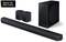 Soundbar-System in Schwarz mit Subwoofer und zwei Lautsprechern. Oben links steht 'Made for Germany'.
