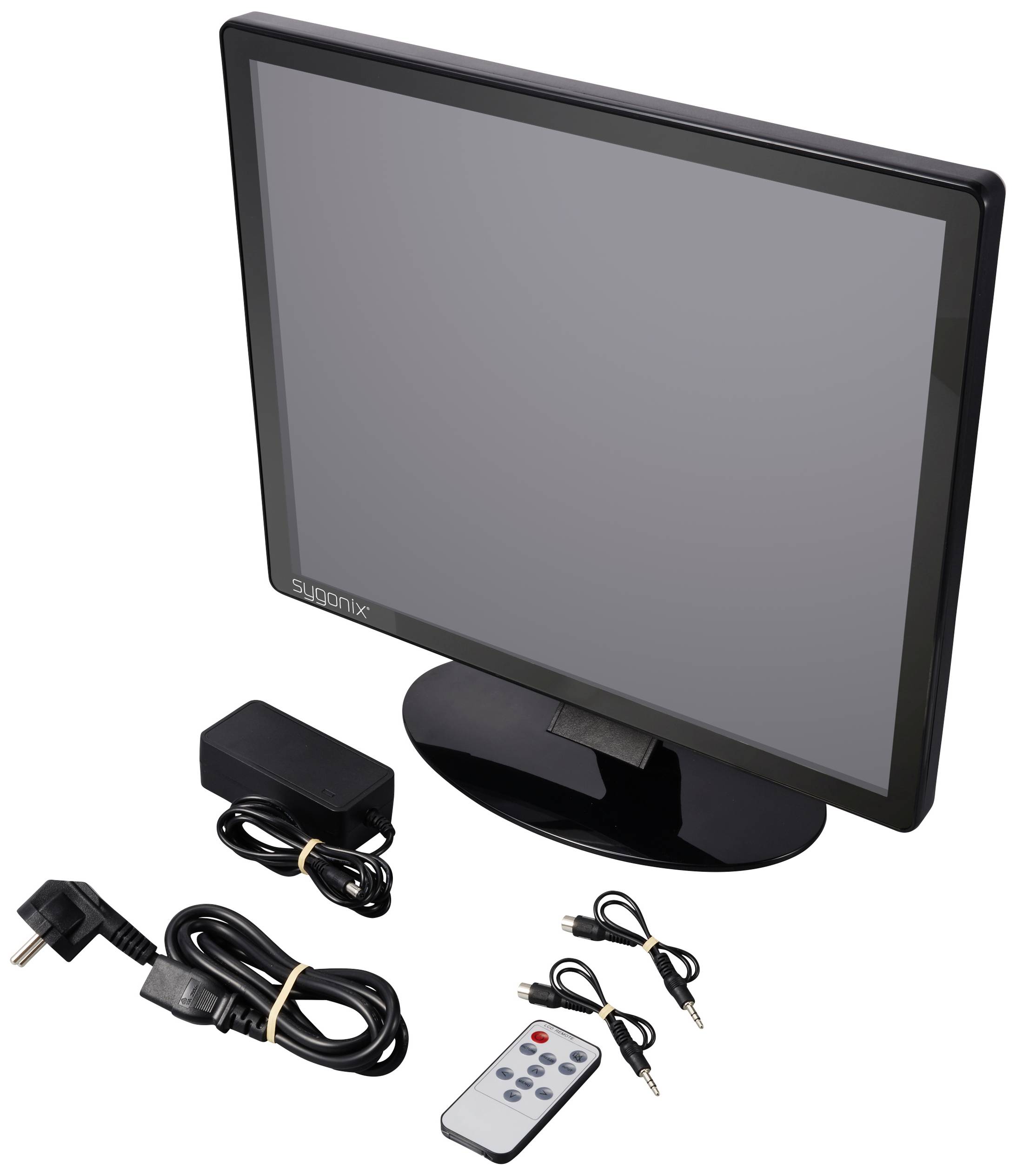 Ein schwarzer Computerbildschirm mit Zubehör: Stromkabel, Adapter, Fernbedienung und zwei Audiokabel, auf einer weißen Fläche.