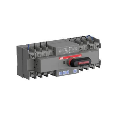 Ein elektrischer Umschalter mit der Aufschrift 'OTM', bestehend aus einem grauen Gehäuse und einem schwarzen Drehschalter.