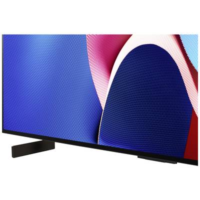Der untere Teil eines modernen Fernsehers mit einem bunten, abstrakten Hintergrund auf dem Bildschirm.