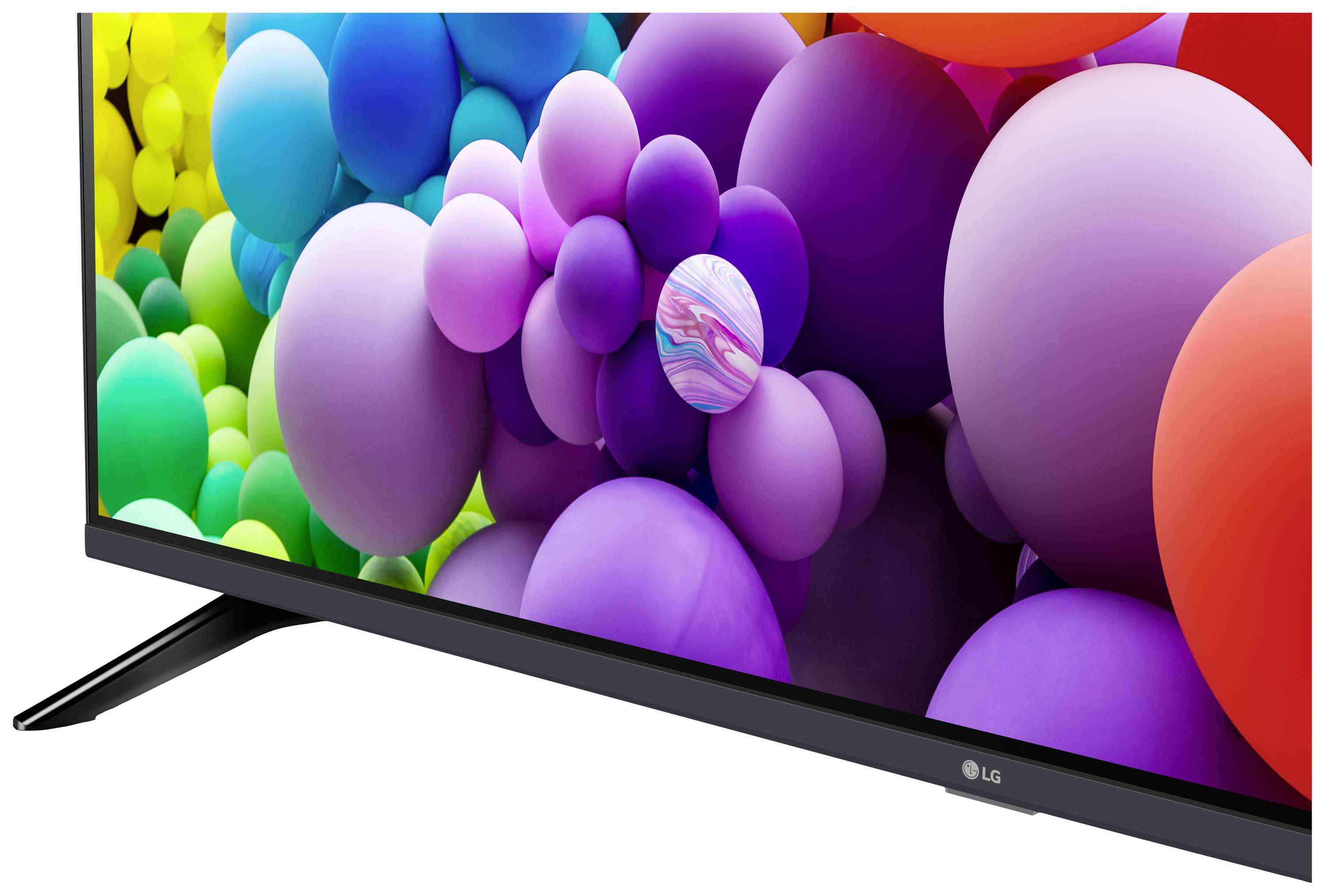 Ein Fernseher mit lebendigem Bild von bunten, schwebenden Kugeln. Der Bildschirm zeigt eine Vielfalt an Farben und Formen.