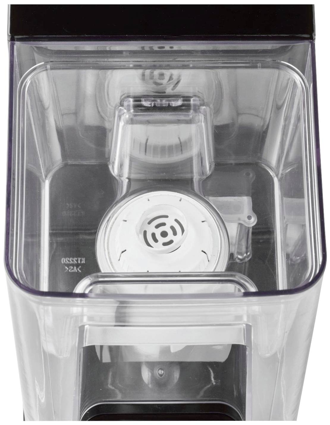 Ein transparenter Behälter einer Kaffeemaschine mit einem weißen Filtereinsatz in der Mitte.