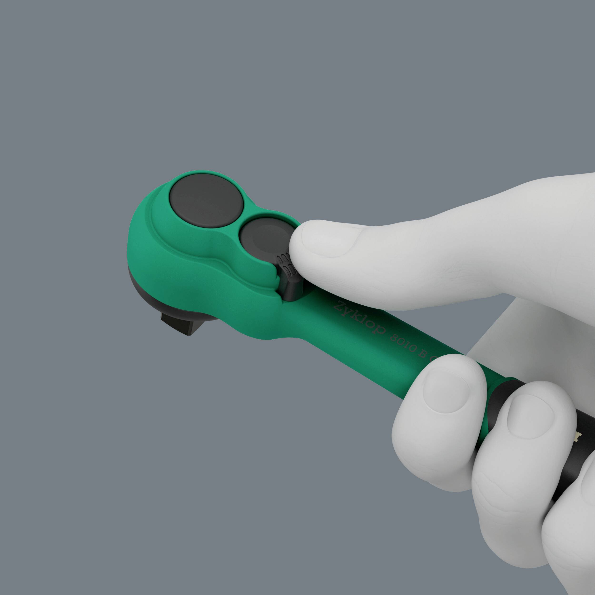 Eine weiße Hand hält einen grünen Edding-Marker horizontal gegen einen grauen Hintergrund.