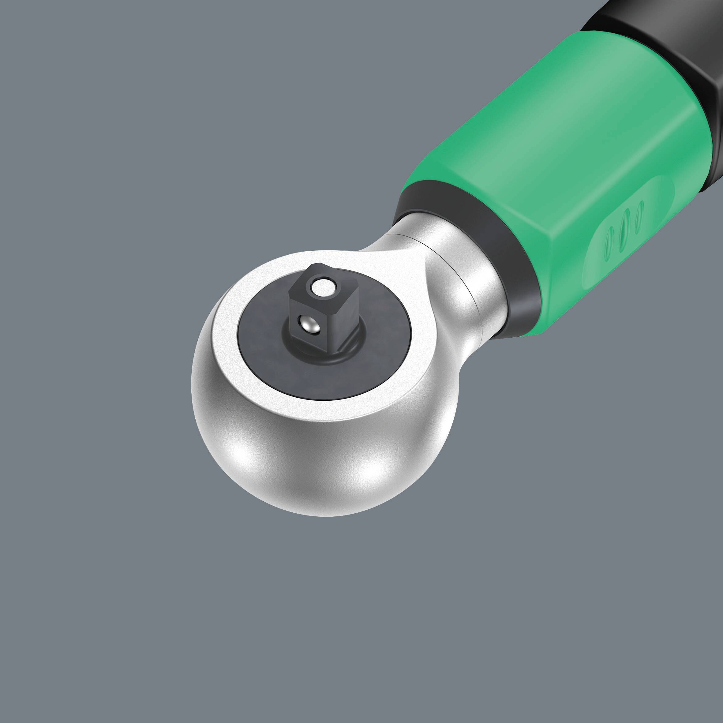 Ein Schraubenschlüssel mit grünem Griff und rundem Kopf in einem grauen Rahmen. Werkzeug zum Lösen oder Anziehen von Schrauben.