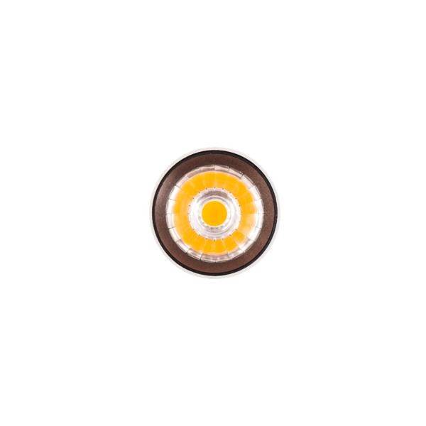 Eine einzelne, runde LED-Lampe mit einem gelben Lichtzentrum und einer klaren äußeren Abdeckung auf weißem Hintergrund.