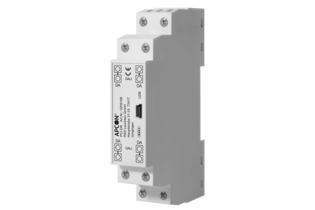 Ein weißes, rechteckiges elektrisches Modul mit mehreren Anschlüssen und Beschriftungen, hauptsächlich zur Steuerung oder Verbindung in elektrischen Systemen.