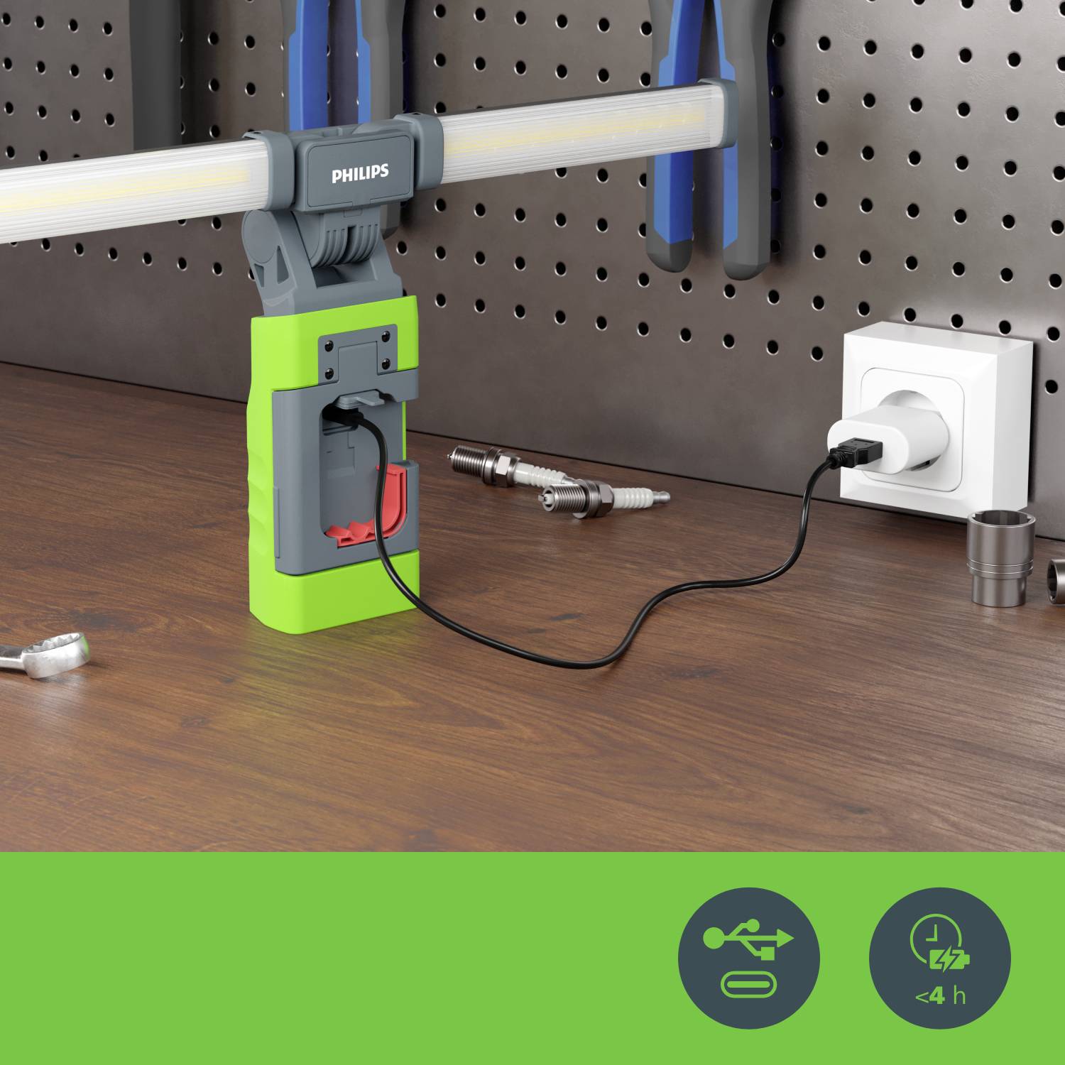 Eine leuchtende LED-Arbeitslampe in einer Werkstatt hängt an einem Steckbrett und wird über eine Steckdose mit Strom versorgt.