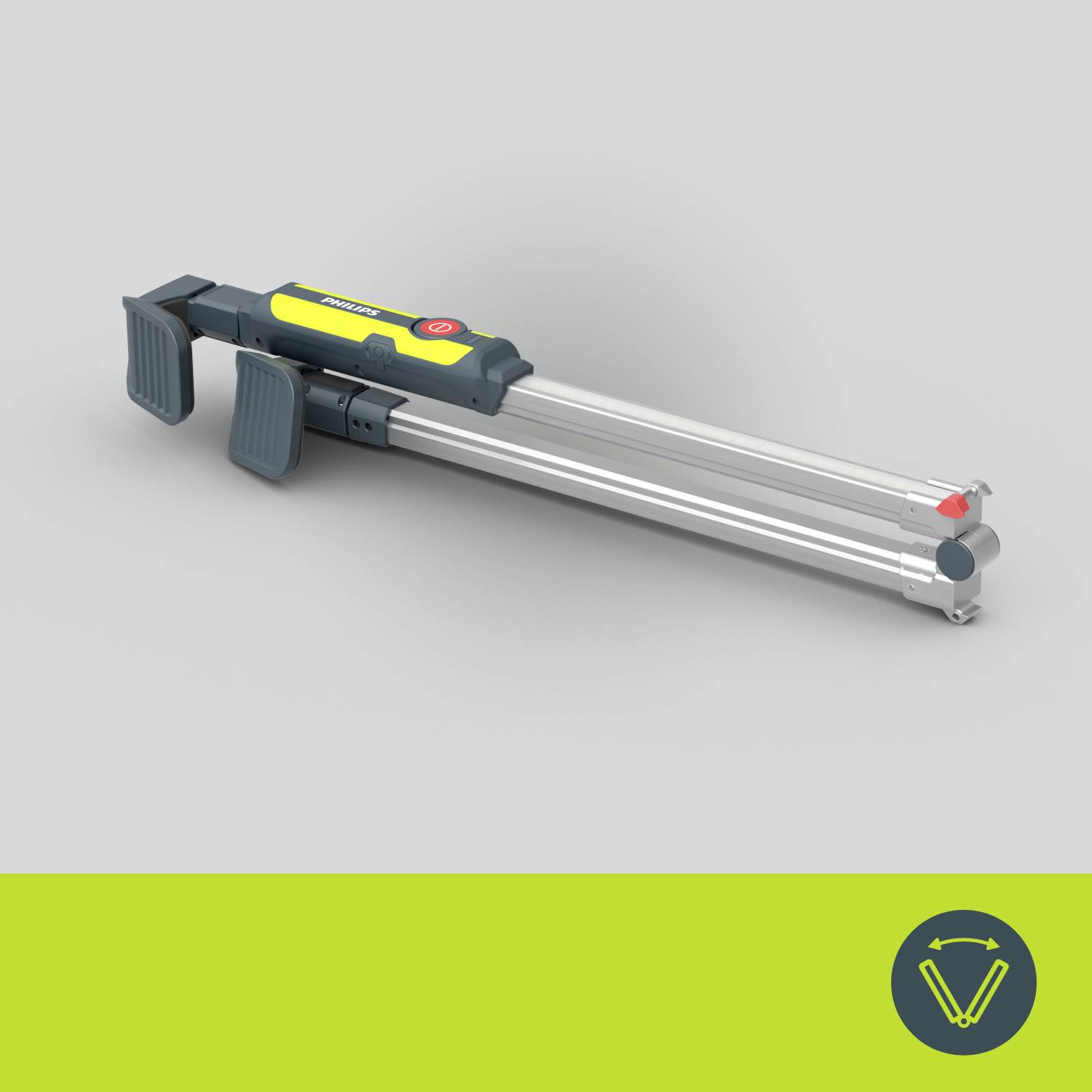 Ein zusammengeklappter, grüner und gelber Selfie-Stick mit zwei grauen Haltegriffen liegt auf einem grauen Hintergrund.