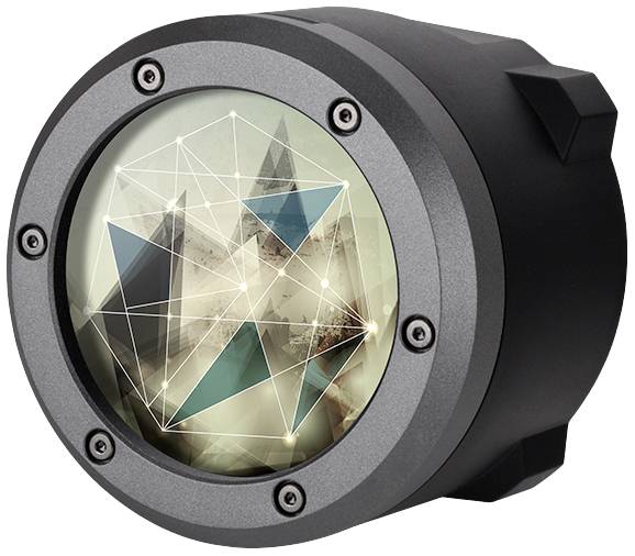 Ein rundes, technisches Gerät mit einem durchsichtigen Deckel zeigt ein abstraktes, geometrisches Design mit Linien und Formen.