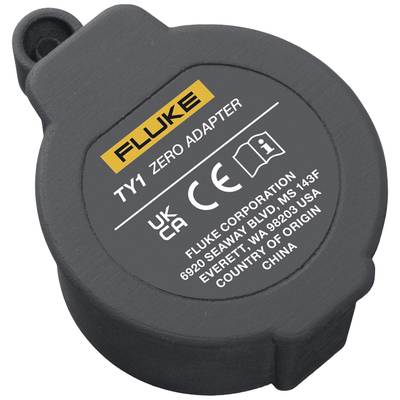 Ein schwarzer, runder Fluke TY1 Zero Adapter mit CE-Zertifizierung. Text: 'Fluke', '6820 Seaway Blvd, MS 143F, Everett, WA 98203, USA'. Herkunft: China.