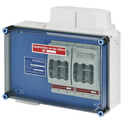 Ein blauer elektrischer Schaltkasten mit zwei Hauptschaltern. Ein Schild zeigt 'Hauptverteiler vor den Zählern' an.