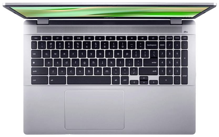 Laptop-Tastatur in Nahaufnahme, Silbergehäuse, Bildschirm leicht geöffnet, grüner Hintergrund sichtbar.