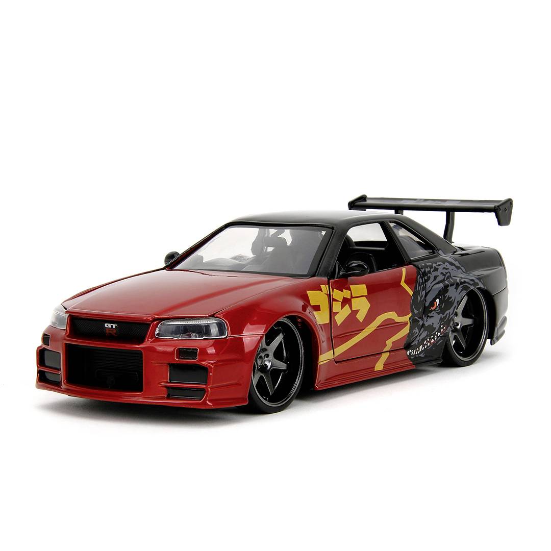 Ein rotes Auto mit Sportdesign und schwarzen Felgen, auffälligem Spoiler und grafischen Elementen an der Seite, steht seitlich.