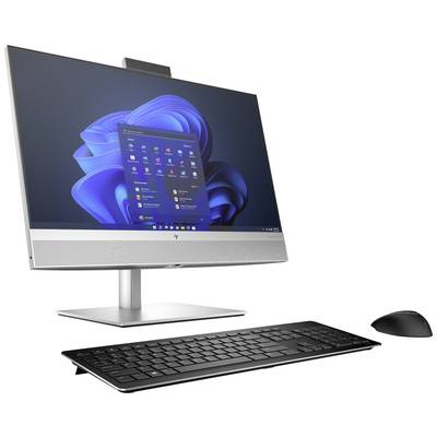 Ein moderner Desktop-Computer mit Tastatur und Maus, auf dem Bildschirm ist ein Betriebssystem mit Symbolen auf dem Desktop zu sehen.