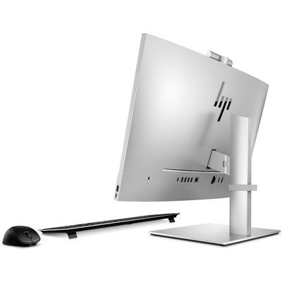 Ein eleganter, weißer Desktop-PC mit schlankem Design von der Seite betrachtet, neben einer kabellosen Maus und Tastatur.