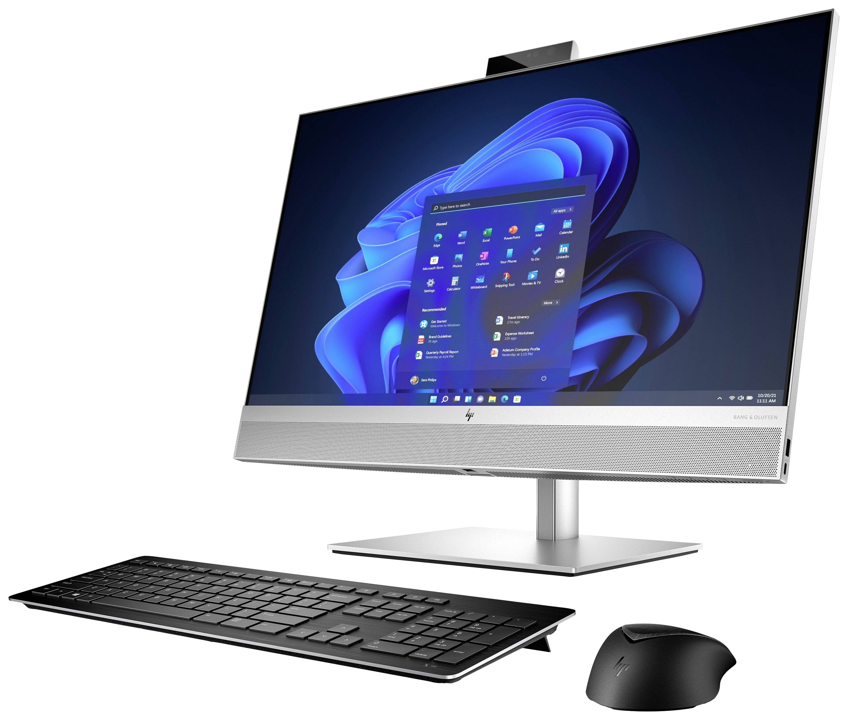 Ein moderner Desktop-Computer mit Flachbildschirm zeigt den Startbildschirm eines Betriebssystems. Eine kabellose Tastatur und Maus sind darunter platziert.