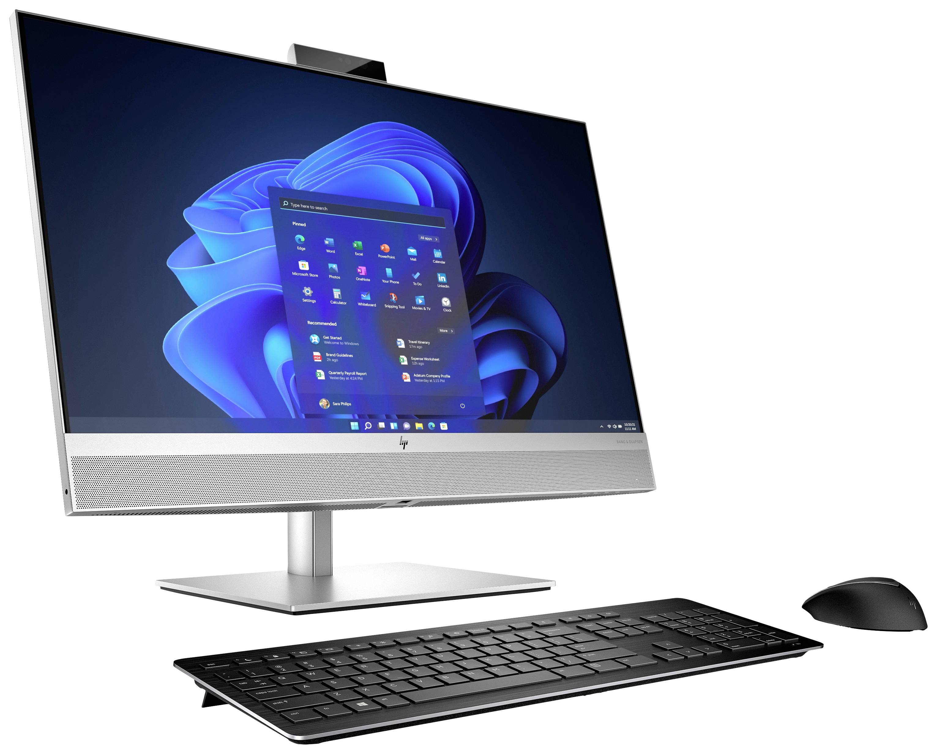 Ein moderner All-in-One-PC mit Tastatur und Maus, zeigt einen Startbildschirm mit verschiedenen Symbolen auf dem Desktop-Hintergrund.