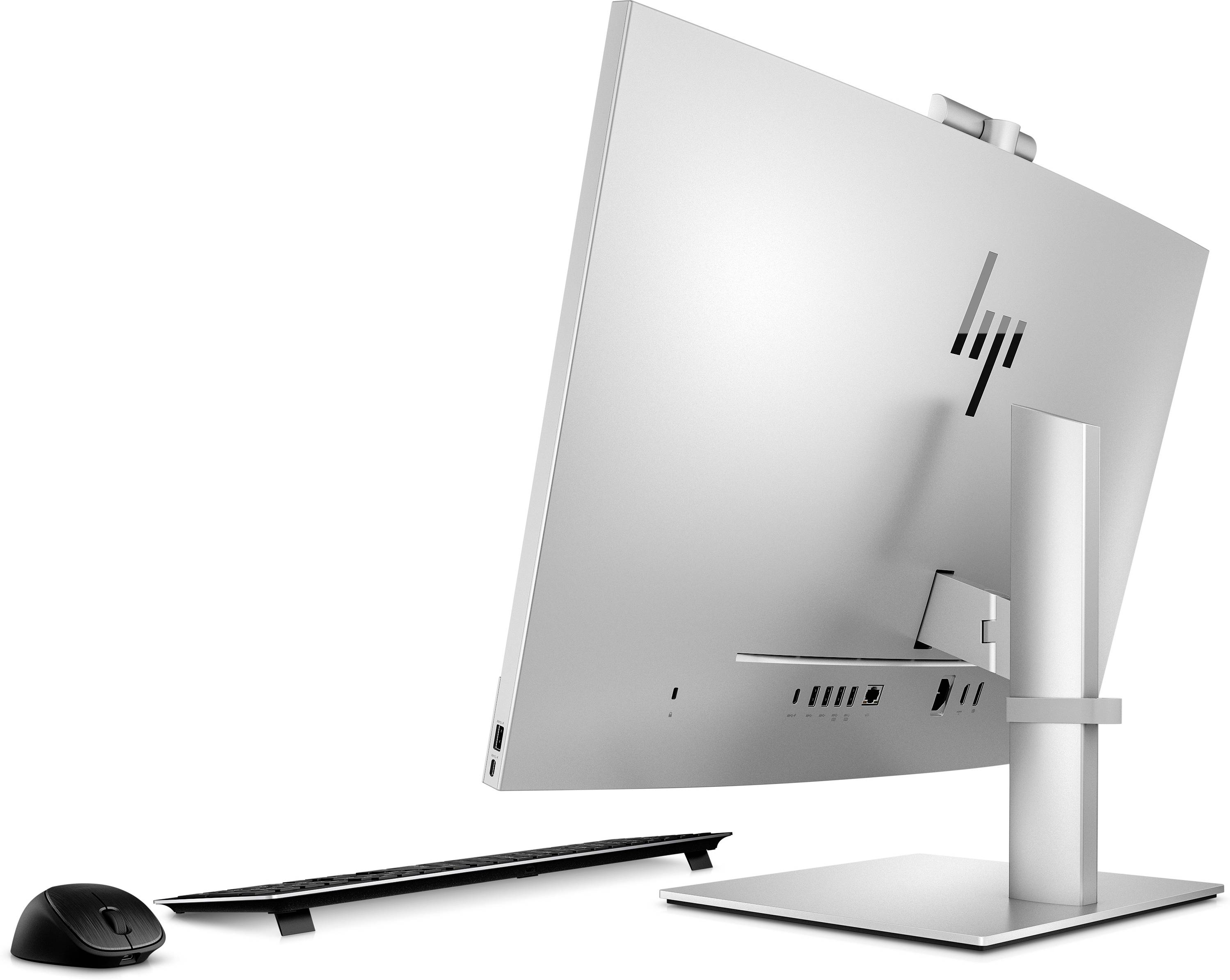 Ein moderner All-in-One-Desktop-Computer in Silber, von hinten gesehen, zusammen mit einer kabellosen Tastatur und Maus.