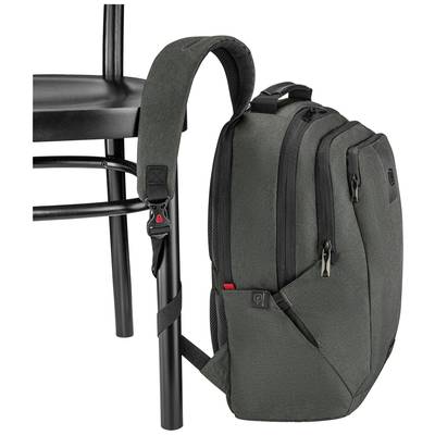 Dunkelgrüner Rucksack hängt an einem schwarzen Stuhl. Der Gurt des Rucksacks ist um das Stuhlbein befestigt.