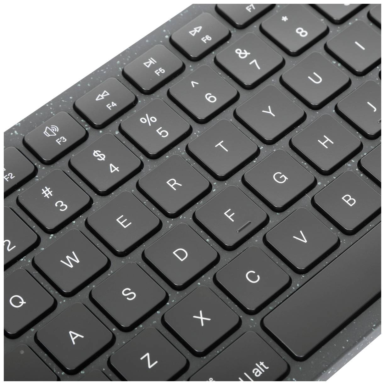 Eine moderne Tastatur, teilweise sichtbar, mit schwarzen Tasten und weißer Beschriftung, zeigt die QWERTY-Anordnung.