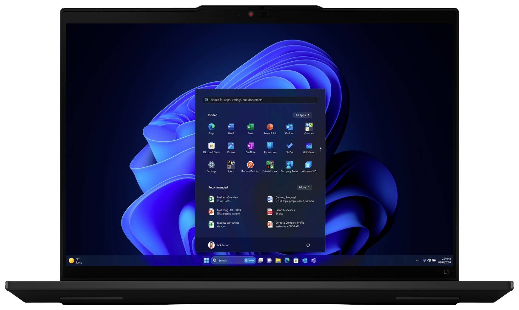 Ein geöffneter Laptop zeigt den Startbildschirm von Windows 11 mit verschiedenen App-Symbolen und einem blauen Hintergrund.