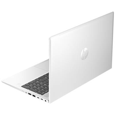 Ein weißer Laptop von der Seite betrachtet, teilweise geöffnet, zeigt die Tastatur und verschiedene Anschlüsse auf der linken Seite.