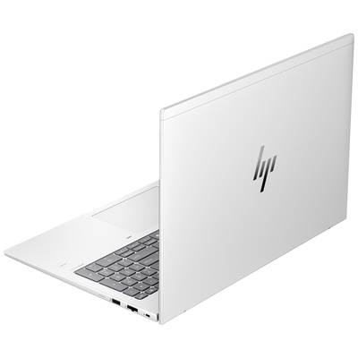 Silberfarbenes Laptop von HP, Rückansicht, auf einem Tisch stehend. Tastatur teilweise sichtbar, Bildschirm nicht erkennbar.