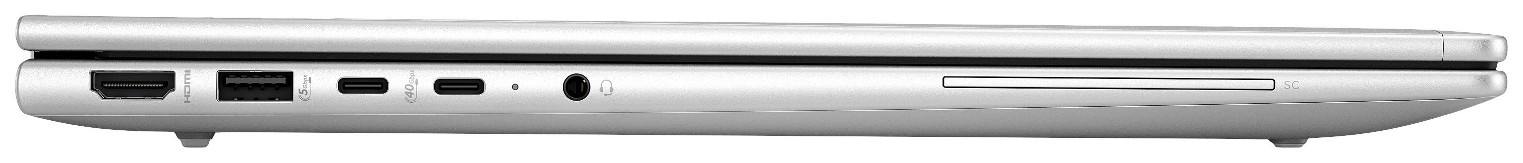 Ein geschlossenes silbernes Laptop von der Seite, sichtbar sind Anschlüsse: HDMI, USB, Kopfhöreranschluss und ein optisches Laufwerk.