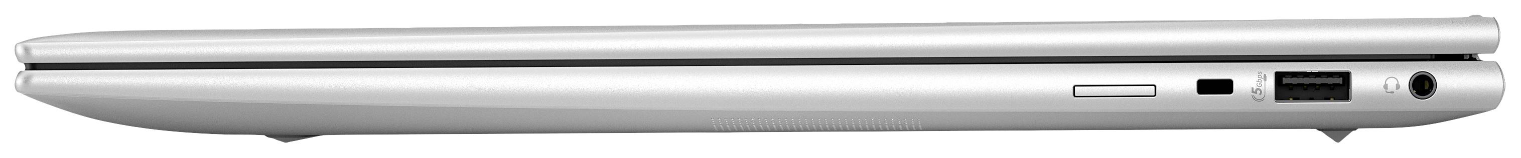 Geschlossener Laptop von der Seite, zeigt Anschlüsse und Belüftung. Schlankes, modernes Design, silberne Farbe.