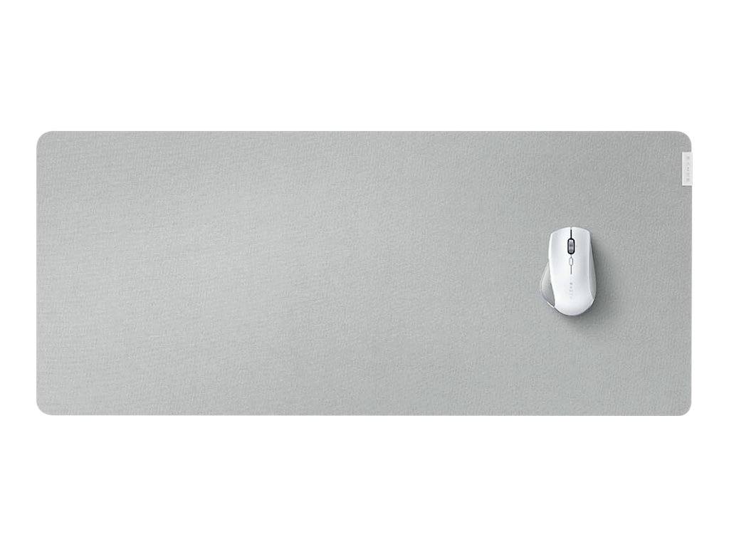 Graues Mauspad mit weißer Maus oben rechts platziert, auf einer glatten, minimalistischen Oberfläche.