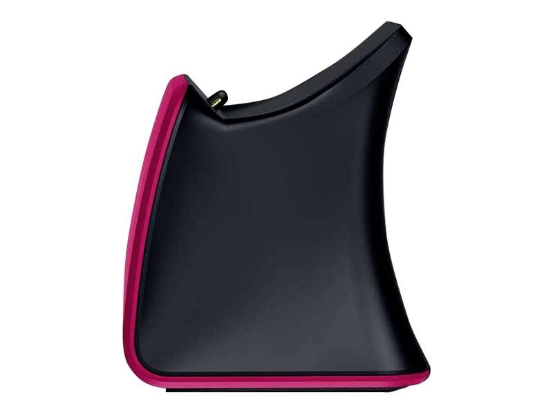 Ein schwarzes Gerät mit geschwungenem Design, rotem Rand und einer vertieften Taste oben. Es erinnert an eine moderne, stilisierte Form.
