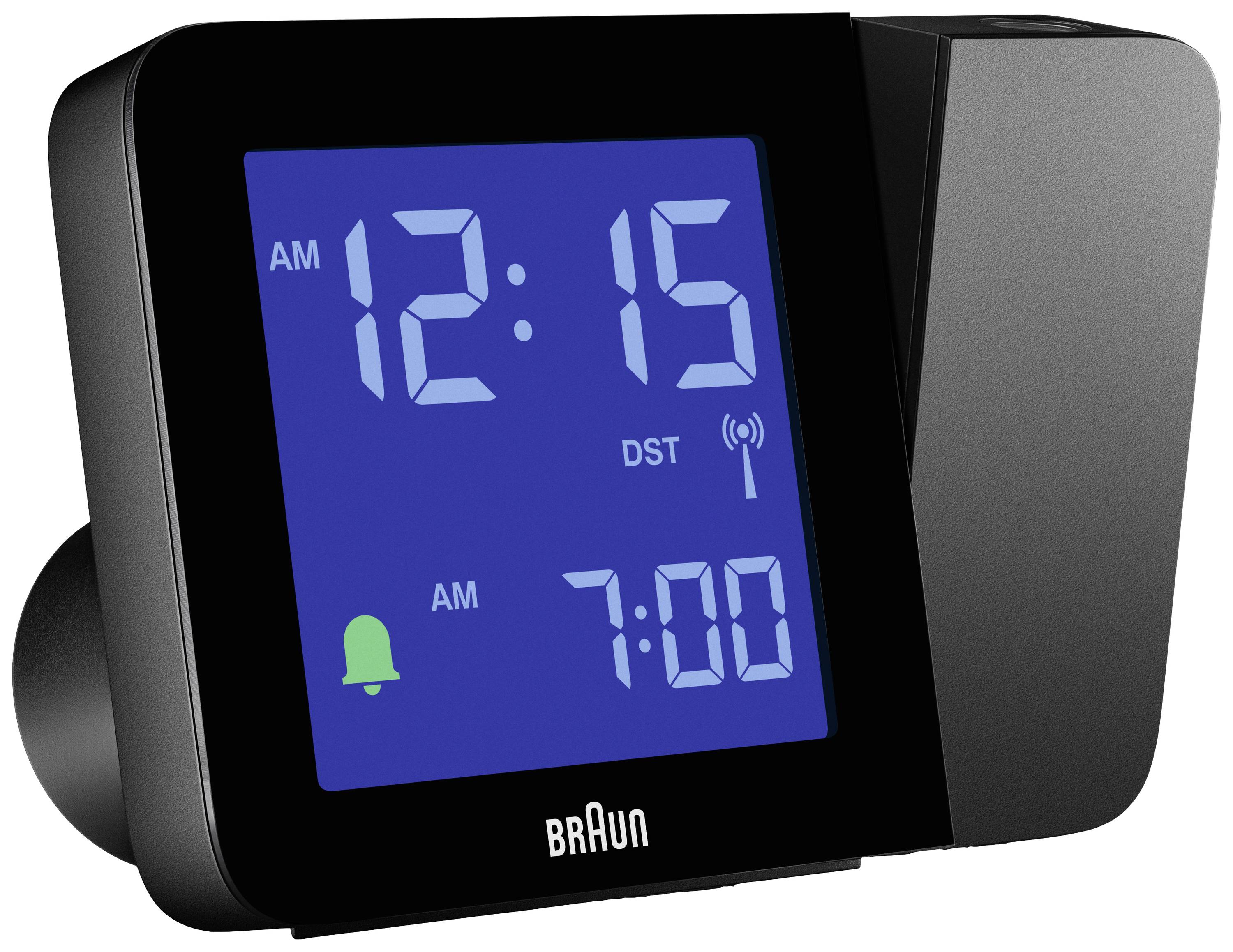 Digitaler Wecker mit blauem Display zeigt '12:15 AM' an. Alarm eingestellt auf '7:00 AM'. Marke 'Braun' sichtbar.