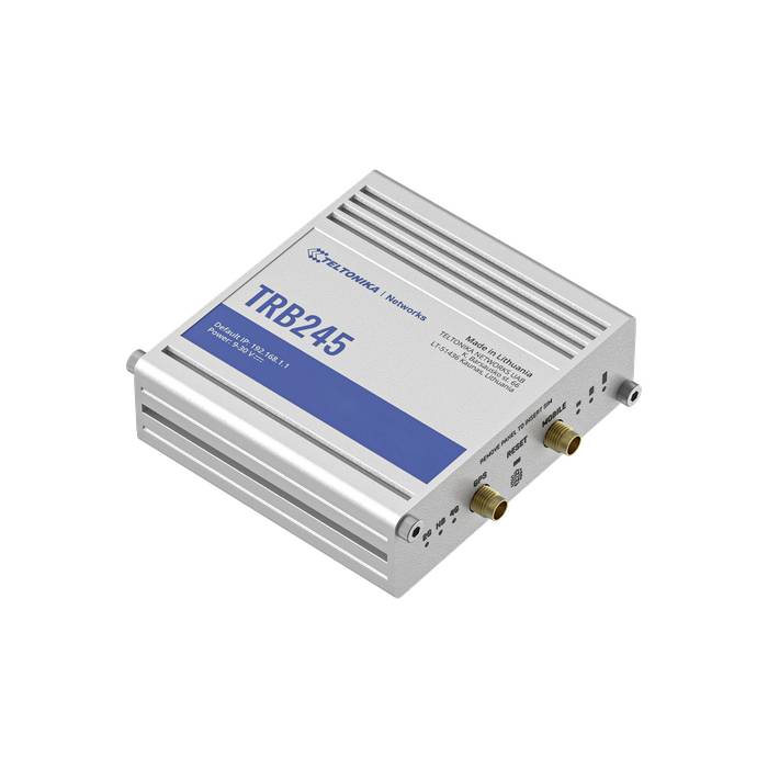 Ein silbernes elektronisches Gerät mit blauer Beschriftung 'TRB245', zeigt Anschlüsse und wird als Netzwerkrouter oder Modem genutzt.