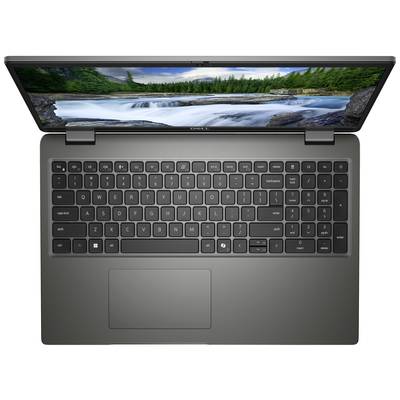 Ein Laptop mit schwarzer Tastatur und einem Bildschirm, der einen Wasserfall und Bäume im Hintergrund zeigt. Sicht von oben.