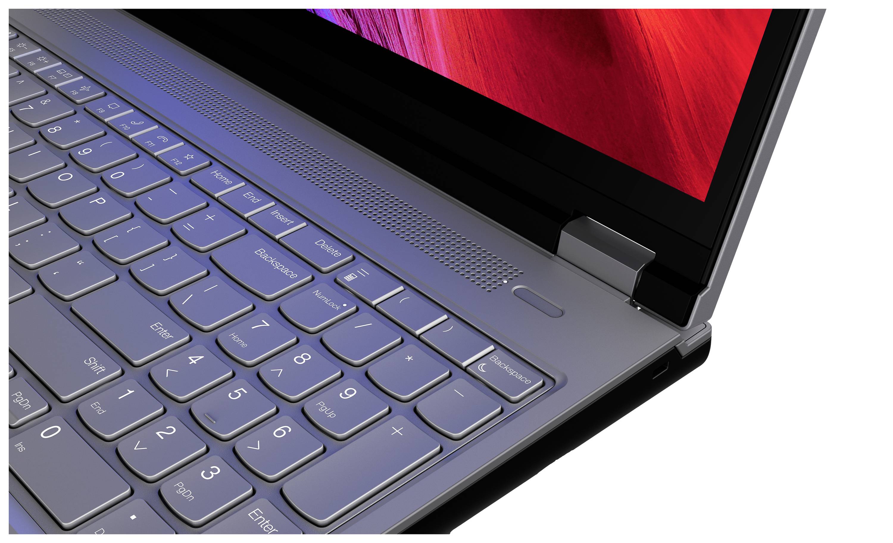 Ein moderner Laptop in Nahaufnahme. Das Bild zeigt die Tastatur und einen Teil des Bildschirms, welcher ein rot-violettes Muster darstellt.