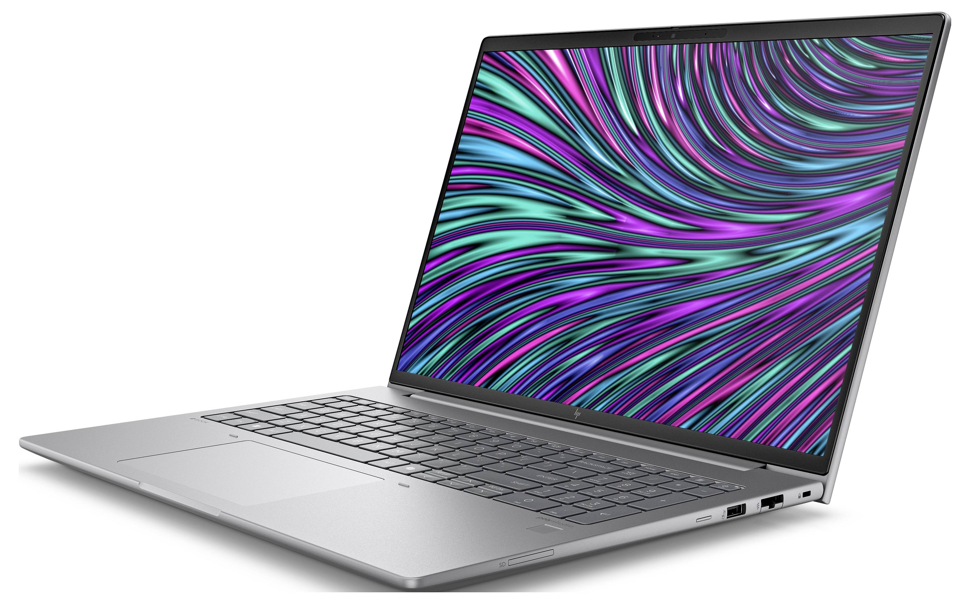 Ein silberner Laptop mit offenem Bildschirm zeigt ein abstraktes, buntes Muster aus violetten und grünen Linien auf schwarzem Hintergrund.