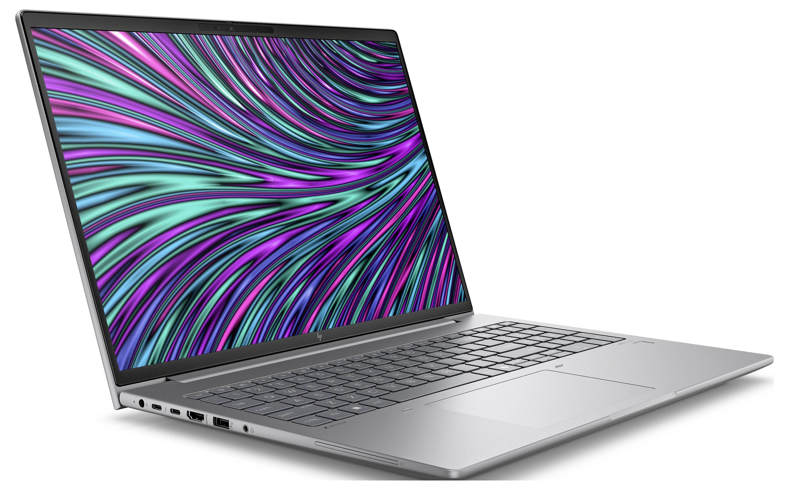 Ein schlanker Laptop mit einem leuchtenden, wellenförmigen Muster auf dem Bildschirm, das aus kräftigen Blau- und Grüntönen besteht.