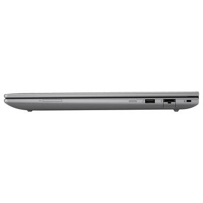 Ein grauer, geschlossener, seitlich aufgenommener Laptop mit mehreren Anschlüssen und einer Disc-Laufwerköffnung.