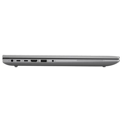 Ein seitlicher Blick auf einen Laptop zeigt mehrere Anschlüsse: USB-C, USB-A, HDMI, und einen SD-Kartensteckplatz.