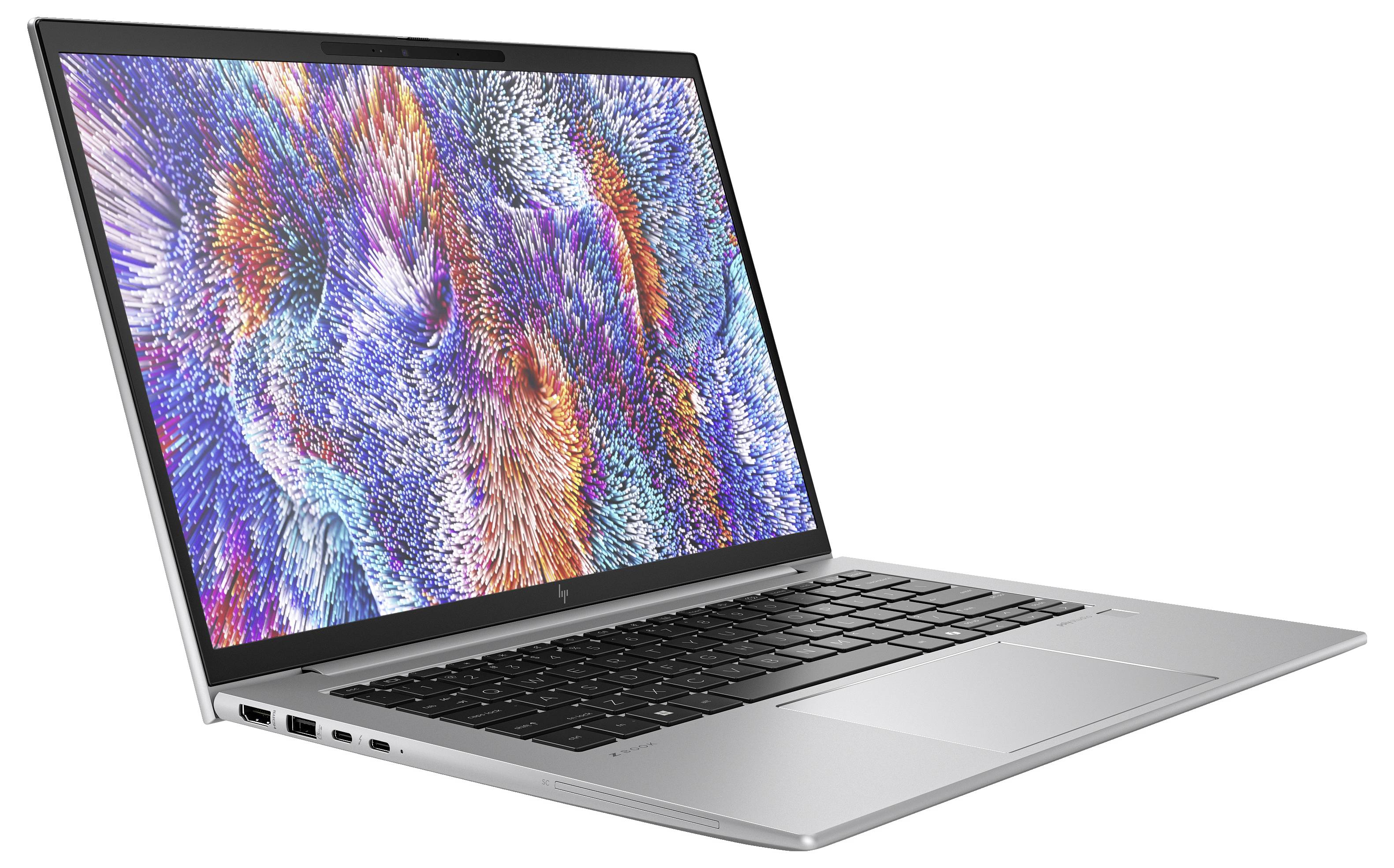 Ein moderner Laptop mit einem bunten, abstrakten Muster auf dem Bildschirm, silbernem Gehäuse und einer schwarzen Tastatur.