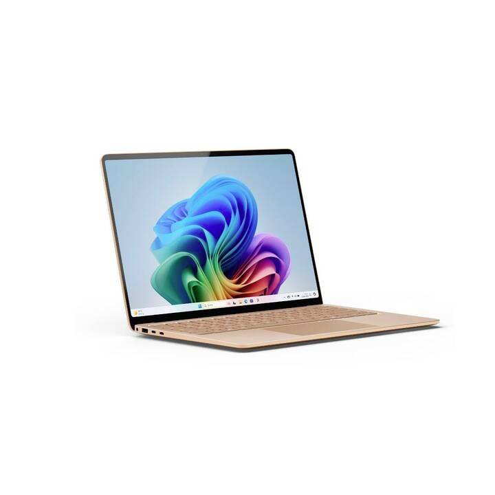 Ein Laptop mit geöffneter Anzeige zeigt ein buntes, abstraktes Design auf dem Bildschirm. Gerät ist goldfarben.